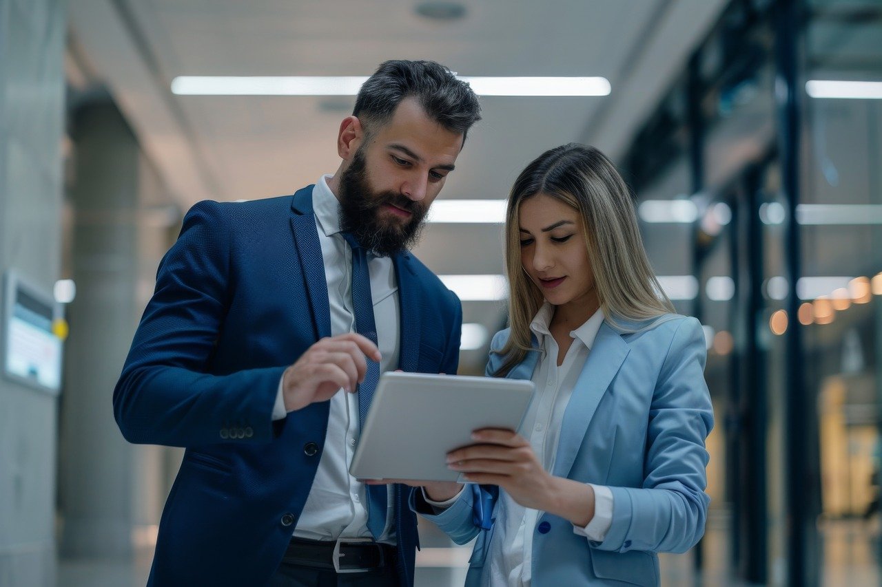 Female sales agent helping a client with a proposal, demonstrating personalized assistance.